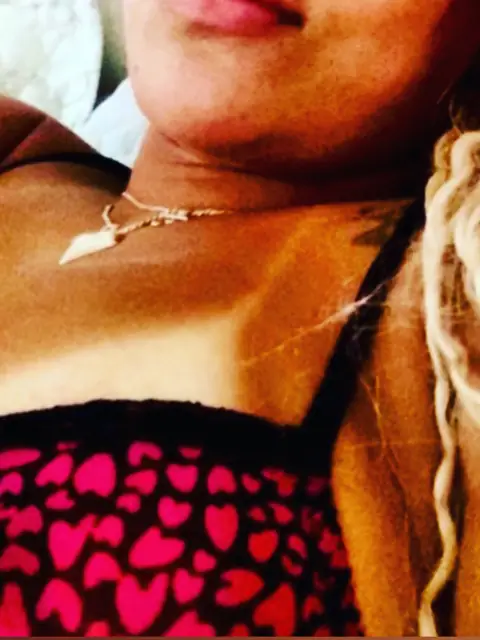 married blonde showing off OnlyFans profile